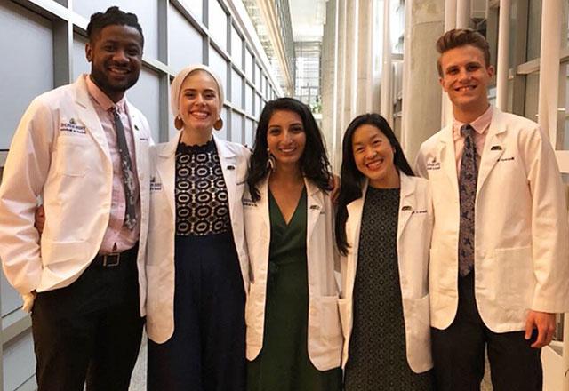 Medical students stand together